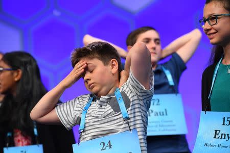 May 31, 2018; National Harbor, MD, USA; Cameron Keith, 12, from Boulder, Colo., stretches during a break during the 2018 Scripps National Spelling Bee at the Gaylord National Resort and Convention Center. Mandatory Credit: Jack Gruber-USA TODAY NETWORK