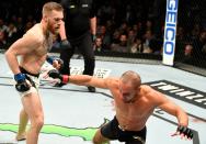 <p>Eddie Alvarez of the United States (right) fights against Conor McGregor of Ireland in their lightweight championship bout during the UFC 205 event at Madison Square Garden on November 12, 2016 in New York City. (Photo by Jeff Bottari/Zuffa LLC/Zuffa LLC via Getty Images) </p>