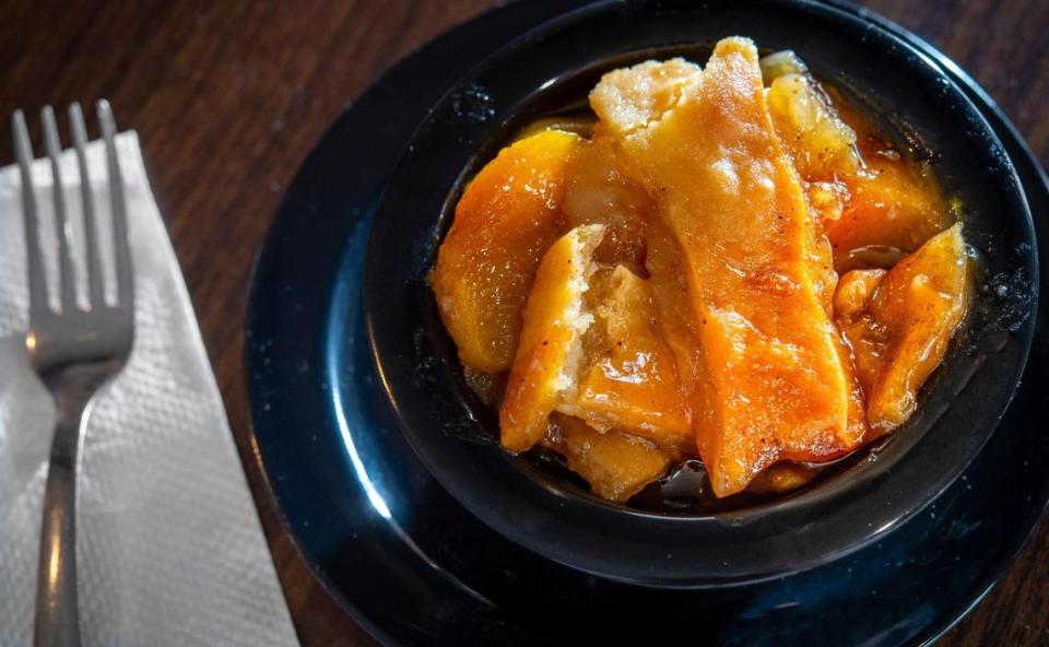 Peach cobbler is one of the most popular dishes at PeachTree Cafe’Teria, 2128 E.12th St.