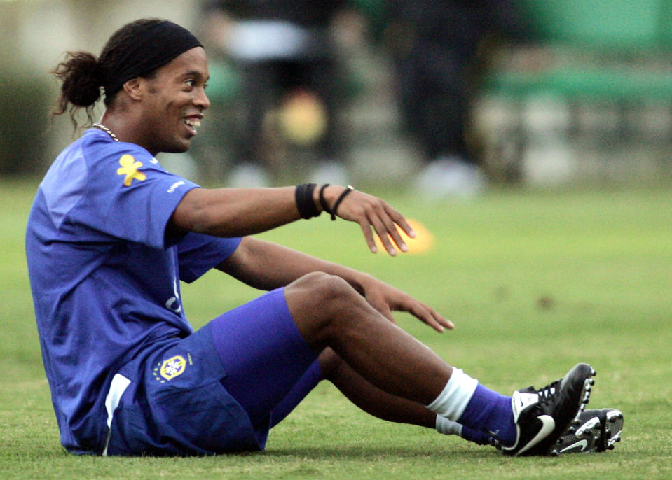 Brazilian soccer star Ronaldinho Gaucho laughs during a training session in Teresopolis, Brazil May 31, 2005. Brazil will face Paraguay in their World Cup qualifying match in the southern Brazilian city of Porto Alegre on Sunday, and Argentina in Buenos Aires on June 8. REUTERS/Sergio Moraes  SM/PN