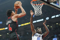 Toronto Raptors forward Scottie Barnes (4) drives to the basket against Dallas Mavericks forward Dorian Finney-Smith (10) during the first half of an NBA basketball game Saturday, Oct. 23, 2021, in Toronto. (Evan Buhler/The Canadian Press via AP)