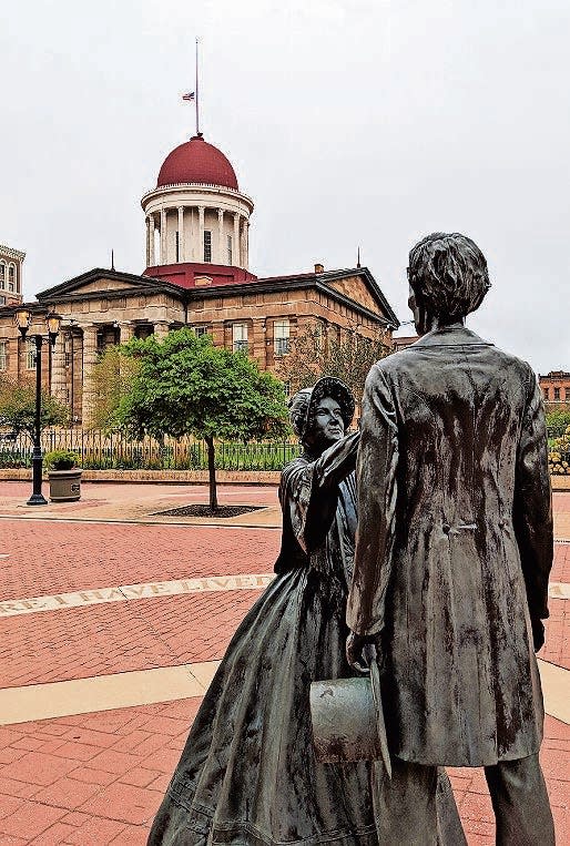 A statue of Abraham Lincoln and his wife, Mary Todd Lincoln, outside the Old State Capitol.