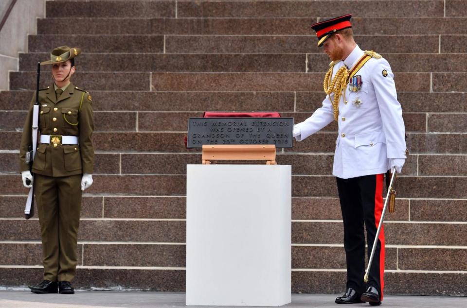 Prince Harry unveils a plaque during the official opening of the refurbished ANZAC Memorial. (AFP/Getty Images)