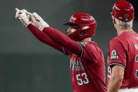 Arizona Diamondbacks' Christian Walker (53) gestures after beating out a throw against the Cincinnati Reds during the fourth inning of a baseball game Wednesday, May 15, 2024, in Phoenix. (AP Photo/Darryl Webb)
