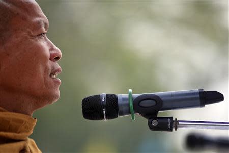 Buddhist monk and anti-government protest leader Luang Pu Buddha Issara addresses his supporters from the stage at a protest site north of Bangkok March 1, 2014. REUTERS/Damir Sagolj