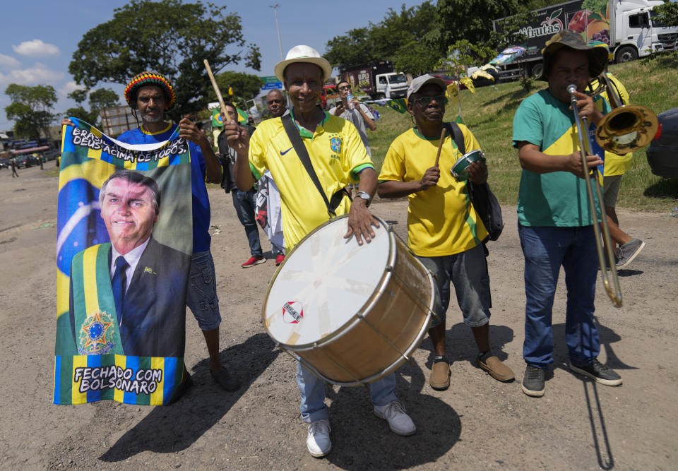 Supporter of former Brazil's President Jair Bolsonaro attend a campaign event launching the pre-candidacy of a mayoral candidate, in Rio de Janeiro, Brazil, Saturday, March 16, 2024. (AP Photo/Silvia Izquierdo)