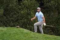 Jon Rahm walks to the 18th green after hitting from the bunker during the third round of the Zozo Championship golf tournament Saturday, Oct. 24, 2020, in Thousand Oaks, Calif. (AP Photo/Marcio Jose Sanchez)