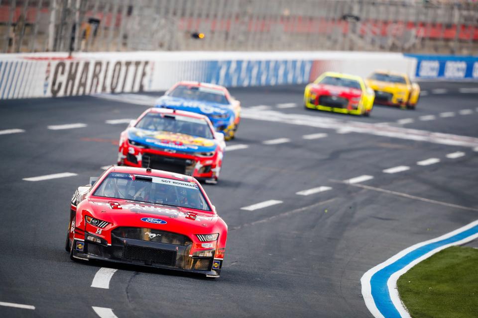 Mitchell's Chase Briscoe leads a train of cars at Charlotte Motor Speedway during the Coca-Cola 600.