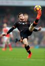 <p>Hull’s Andrew Robertson clears the danger</p>