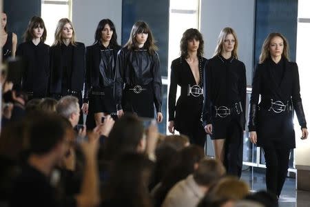 Models present creations by designer Anthony Vaccarello as part of his Autumn/Winter 2015/2016 women's ready-to-wear collection during Paris Fashion Week March 3, 2015. REUTERS/Charles Platiau