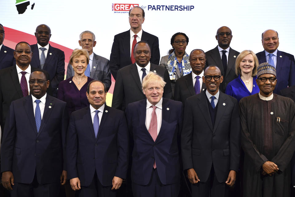 Britain's Prime Minister Boris Johnson, front center, hosts the UK Africa Investment Summit in London, Monday Jan. 20, 2020. Boris Johnson is hosting 54 African heads of state or government in London. The move comes as the U.K. prepares for post-Brexit dealings with the world. Front row from left, Senegal's President Macky Sall, Egypt's President Abdel Fattah al-Sisi, Britain's Prime Minister Boris Johnson, Rwanda's President Paul Kagame, Nigeria's President Muhammadu Buhari. Center row from left, Malawi's President Peter Mutharika, Britain's Business Secretary Andrea Leadsom, Kenya's President Uhuru Kenyatta, Guinea's President Alpha Conde, Britain's International Trade Secretary Liz Truss. Top row from left, Angola's President Joao Lourenco, Algeria's President Abdelmadjid Tebboune, World Bank President David Malpass, UN executive secretary of Economic Commission for Africa Vera Songwe and IMF Africa Director Abebe Aemro Selassie. (Ben Stansall/Pool via AP)