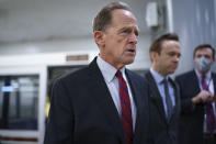 Sen. Pat Toomey, R-Pa., arrives for votes on amendments to advance the $1 trillion bipartisan infrastructure bill, at the Capitol in Washington, Wednesday, Aug. 4, 2021. (AP Photo/J. Scott Applewhite)