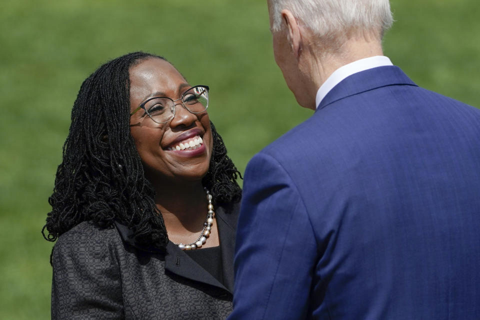 FILE - Judge Ketanji Brown Jackson shakes hands with President Joe Biden after he introduced her to speak at an event on the South Lawn of the White House in Washington, April 8, 2022, celebrating the confirmation of Jackson as the first Black woman to reach the Supreme Court. Biden on Tuesday night will stand before a joint session of Congress for the first time since voters in the midtem elections handed control of the House to Republicans. (AP Photo/Andrew Harnik, File)