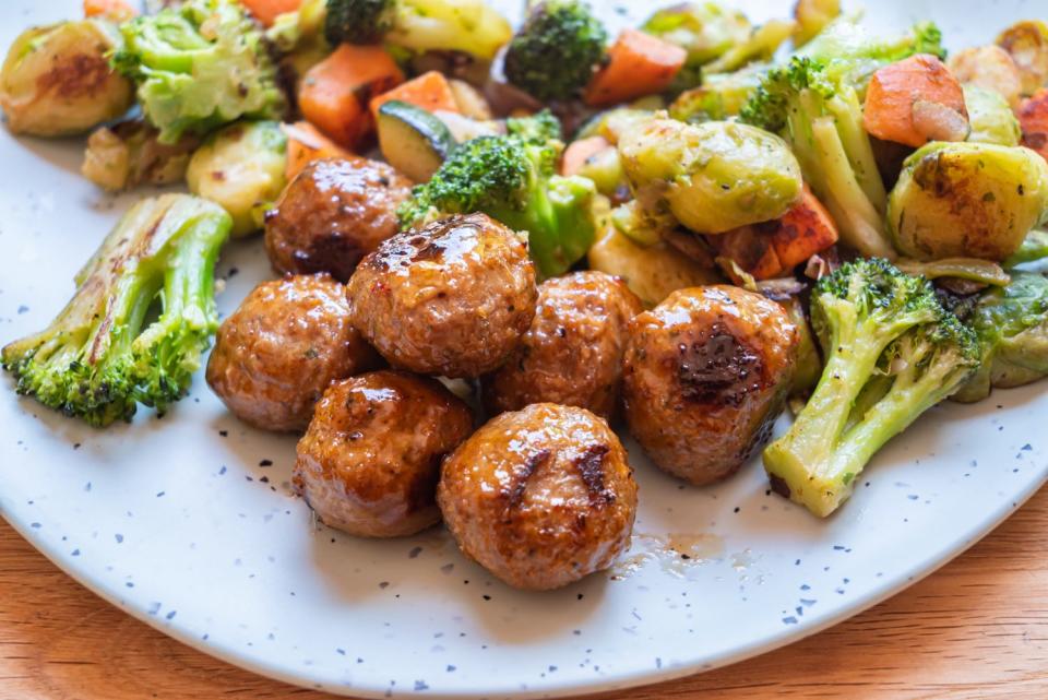 meatballs on plate with broccoli and other vegetables