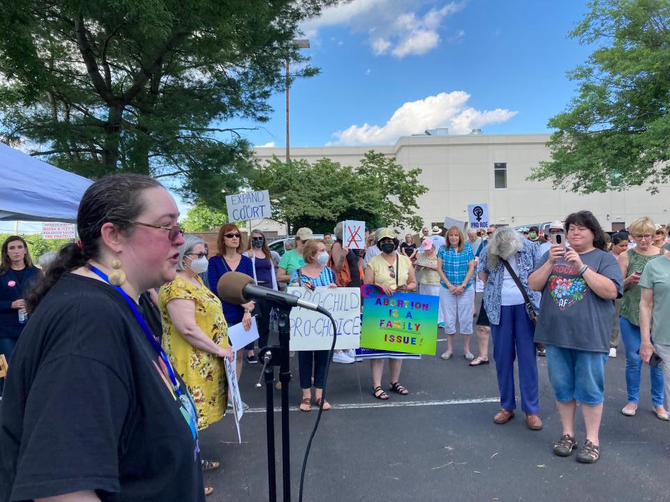 Kierstyn Zolfo, of Newtown Township, speaks at a rally outside the Middletown office of Congressman Brian Fitzpatrick on Friday, June 24, 2022.