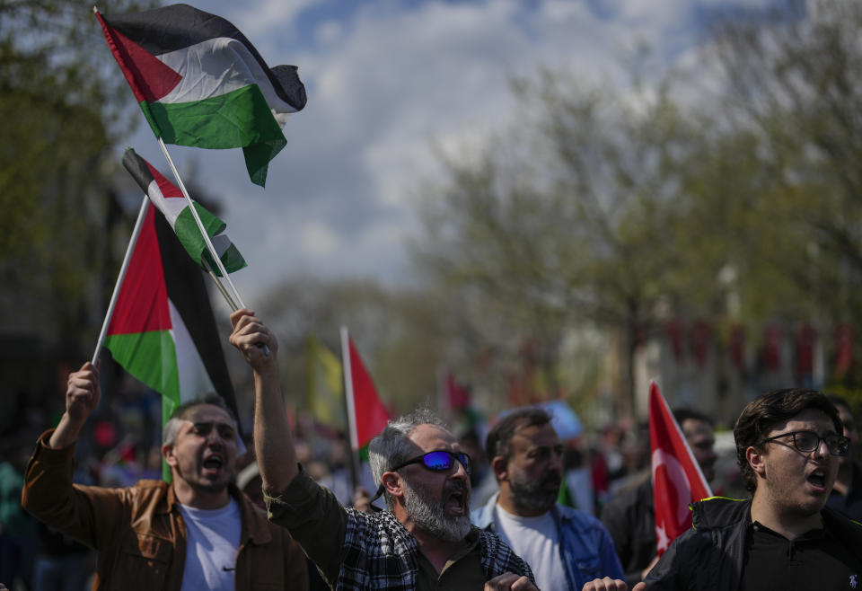 Supporters of Palestinians in Gaza protest in Istanbul, Turkey, Friday, April 5, 2024. (AP Photo/Khalil Hamra)