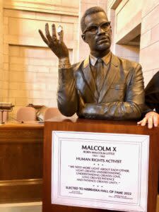  The bust of Malcolm X, born Malcolm Little in 1925 in Omaha, was unveiled during the induction ceremony. (Cindy Gonzalez/Nebraska Examiner)