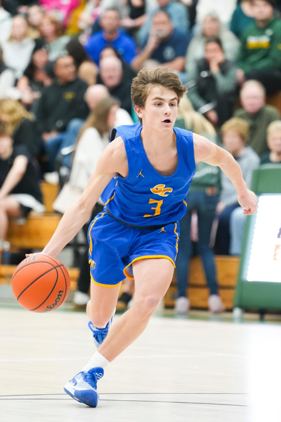 Greenfield-Central Cougars Boston Willard (3) dribbles the ball down the court Friday, Jan. 26, 2024, as the game starts at Pendleton Heights High School in Pendleton. The Greenfield-Central Cougars defeated the Pendleton Heights Arabians 74-72 in double overtime.