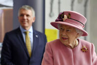 Britain's Queen Elizabeth II visits the Defence Science and Technology Laboratory (DSTL) at Porton Down, England, Thursday Oct. 15, 2020, to view the Energetics Enclosure and display of weaponry and tactics used in counter intelligence. (Ben Stansall/Pool via AP)