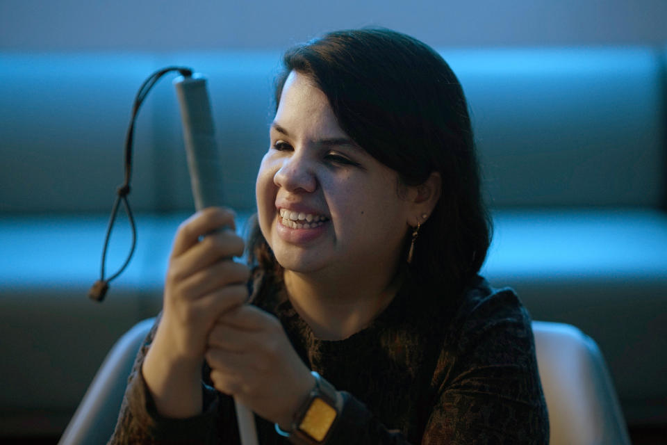 Sandy Murillo sits for a portrait at The Chicago Lighthouse, which provides services to blind and low-vision residents, on Wednesday, April 26, 2023, in Chicago. Murillo, a lifelong Chicago-area resident who was born with glaucoma and lost her sight at age 2, said she didn't even know about accessible pedestrian signals until she heard a strange voice say “walk” during a childhood family trip to southern California. (AP Photo/Charles Rex Arbogast)