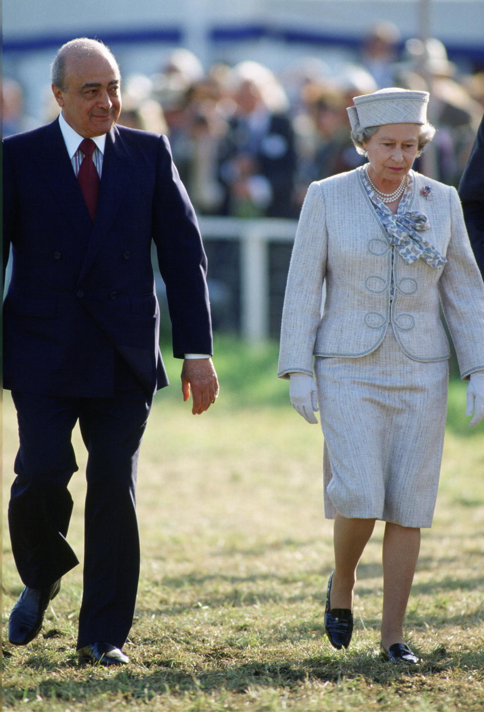 WINDSOR, UNITED KINGDOM - MAY 17:  Queen Elizabeth II At The Windsor Horse Show With One Of The Show's Sponsors Mohammed Al-fayed Of The Harrods Shop. Mr Al-fayed Is The Father Of  Dodi Al-fayed. The Queen Is Wearing A Pale Grey Suit By Fashion Designer John Anderson.  (Photo by Tim Graham Photo Library via Getty Images)