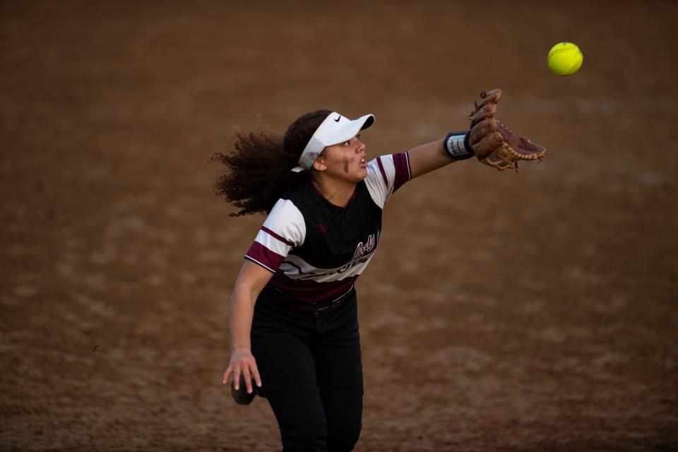 Henderson County's JaMyra Byrum makes the catch on a Castle foul ball at Castle High School Tuesday evening, April 12, 2022.