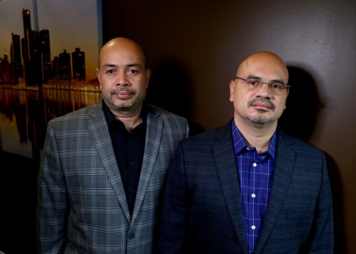 Brothers Melvin, left, and George DeJesus after a press conference with their lawyer Wolf Mueller at his Novi law office Tuesday, Nov 29, 2022. The brothers, who served 25 years in prison, were exonerated in March 2022 in a murder case from 1995. They're seeking $125 million in a lawsuit against the Oakland County detective, the polygraph examiner and Oakland County, alleging police fabricated and withheld evidence.