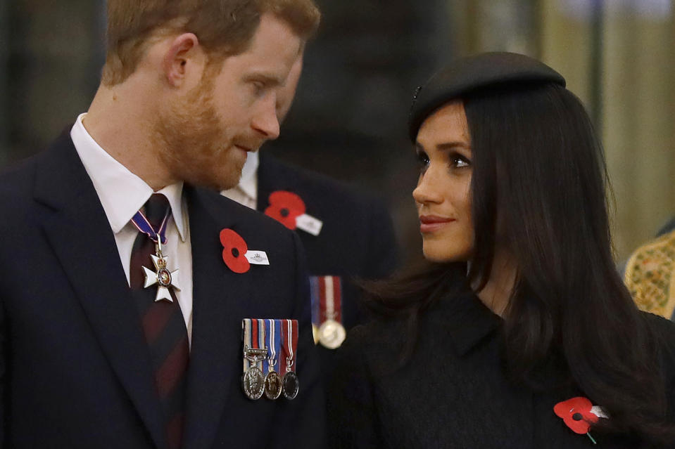 TOPSHOT - Britain's Prince Harry (L) and his US fiancee Meghan Markle attend a service of commemoration and thanksgiving to mark Anzac Day in Westminster Abbey in London on April 25, 2018. - Anzac Day marks the anniversary of the first major military action fought by Australian and New Zealand forces during the First World War. The Australian and New Zealand Army Corps (ANZAC) landed at Gallipoli in Turkey during World War I. (Photo by Kirsty Wigglesworth / POOL / AFP)        (Photo credit should read KIRSTY WIGGLESWORTH/AFP via Getty Images)