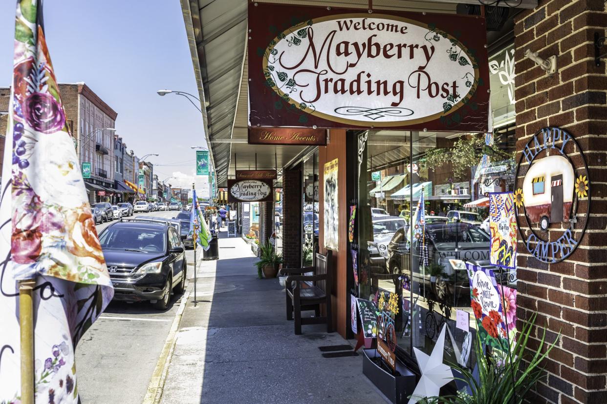 Mount Airy, NC, USA-5 June 2021: A view down busy Main Street past the colorful Mayberry Trading Post.