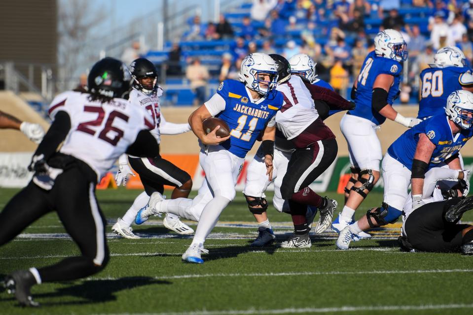 SDSU’s Mark Gronowski (11) runs with the ball during a game against Missouri State on Saturday, Nov. 18, 2023 at Dana J. Dykhouse Stadium in Brookings, South Dakota.