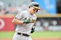 May 22, 2019; Cleveland, OH, USA; Oakland Athletics catcher Nick Hundley (3) rounds the bases after hitting a home run during the second inning against the Cleveland Indians at Progressive Field. Mandatory Credit: Ken Blaze-USA TODAY Sports