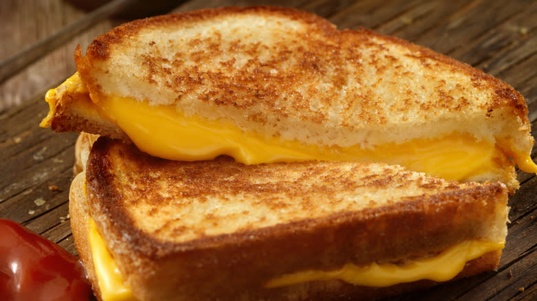 grilled cheese sandwich on wooden table