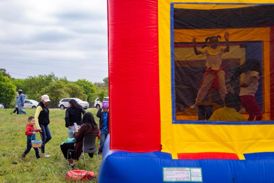 Children and families play at the Como Community Center before the egg hunt begins in Fort Worth on Saturday, April 8, 2023.