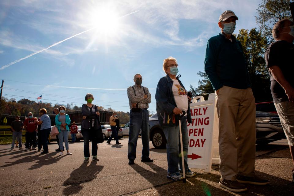 Early voters line up outside of the Vienna Community Building to cast their ballots in Vienna, West Virginia, on October 21, 2020.
