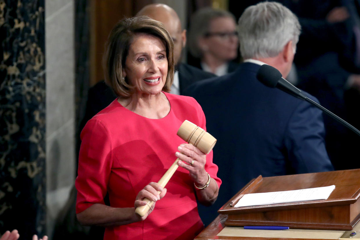 Nancy Pelosi (D-CA) smiles after receiving the gavel from Rep. Kevin McCarthy (R-CA) during the first session of the 116th Congress at the U.S. Capitol January 03, 2019 in Washington, DC. (Photo by Win McNamee/Getty Images)