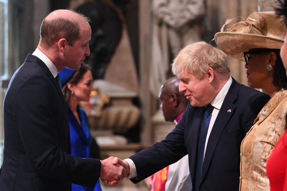 Prince William, Duke of Cambridge, shakes hands with Prime Minister Boris Johnson (POOL/AFP via Getty Images)