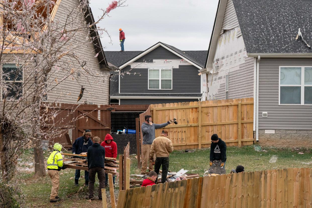 Volunteers work on clearing debis in Clarksville, Tenn., Sunday, Dec. 10, 2023. Tornadoes struck Middle Tennessee on Saturday, killing at least six people and leaving more than 160,000 Middle Tennessee residents without power.