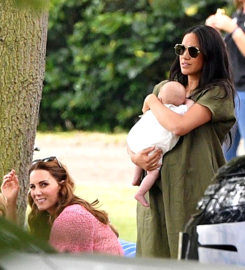 The Duchess of Sussex sported aviator style sunglasses with gold frames with a flowing khaki green dress by <a href="https://click.linksynergy.com/deeplink?id=93xLBvPhAeE&mid=37420&murl=https%3A%2F%2Fwww.matchesfashion.com%2Fus%2Fproducts%2F1256781&u1=PEO%2CMeghanMarkleDebutsHerLaid-backCaliforniaMomStylewithArchieatFamilyOuting%2Cstephpetit%2CUnc%2CPos%2C7148151%2C201907%2CI" rel="nofollow noopener" target="_blank" data-ylk="slk:Lisa Marie Fernandez;elm:context_link;itc:0;sec:content-canvas" class="link ">Lisa Marie Fernandez</a> — choosing to forego the outfit’s belted bow option.