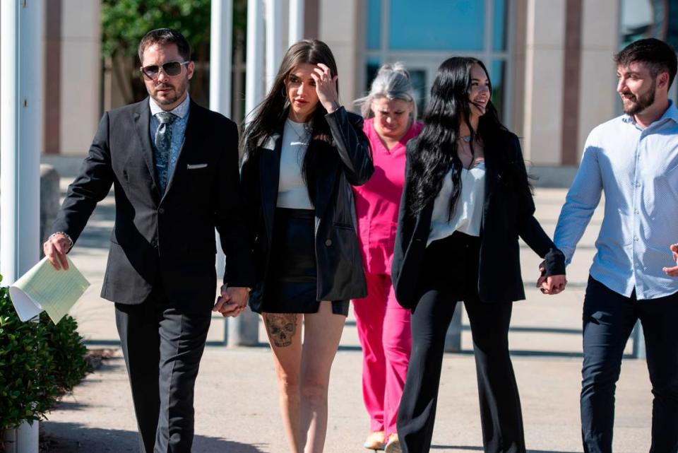 Robert Deming III, left, and Deming’s family members leave Dan M. Russell Jr. Federal Courthouse in Gulfport on Wednesday, May 1, 2024, after Deming pleaded guilty to selling products containing synthetic cannabinoids at his Candy Shop kratom stores.