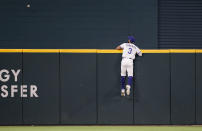 Texas Rangers center fielder Leody Taveras (3) watches as Chicago White Sox's Yasmani Grandal's home run sails over the outfield wall during the sixth inning of a baseball game, Saturday, Sept. 18, 2021, in Arlington, Texas. (AP Photo/Brandon Wade)