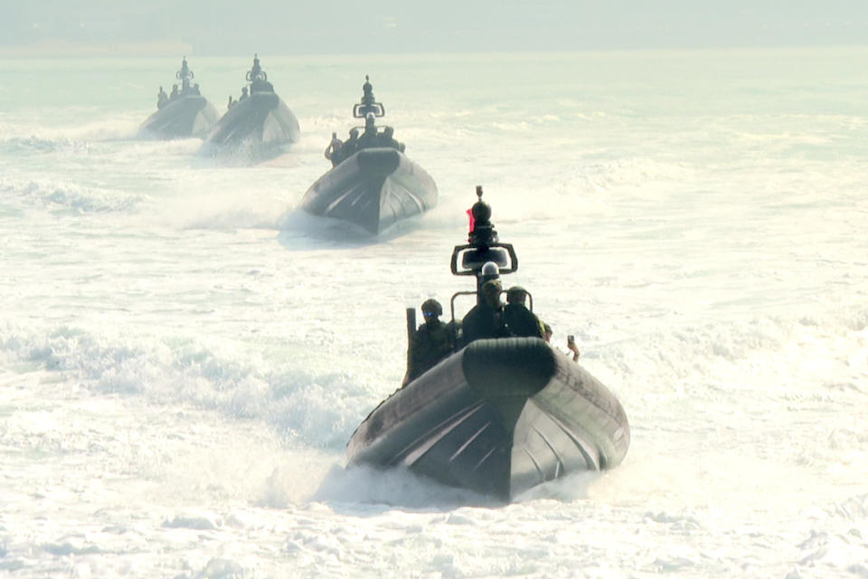 In this image taken from video, assault boats take part in naval drills in Kaohsiung, Southern Taiwan on Wednesday, Jan. 31, 2024. Taiwan is holding spring military drills following its recent presidential election and amid threats from China, which claims the island as its own territory that it is determined to annex, possibly by force.(AP Photo/Johnson Lai)