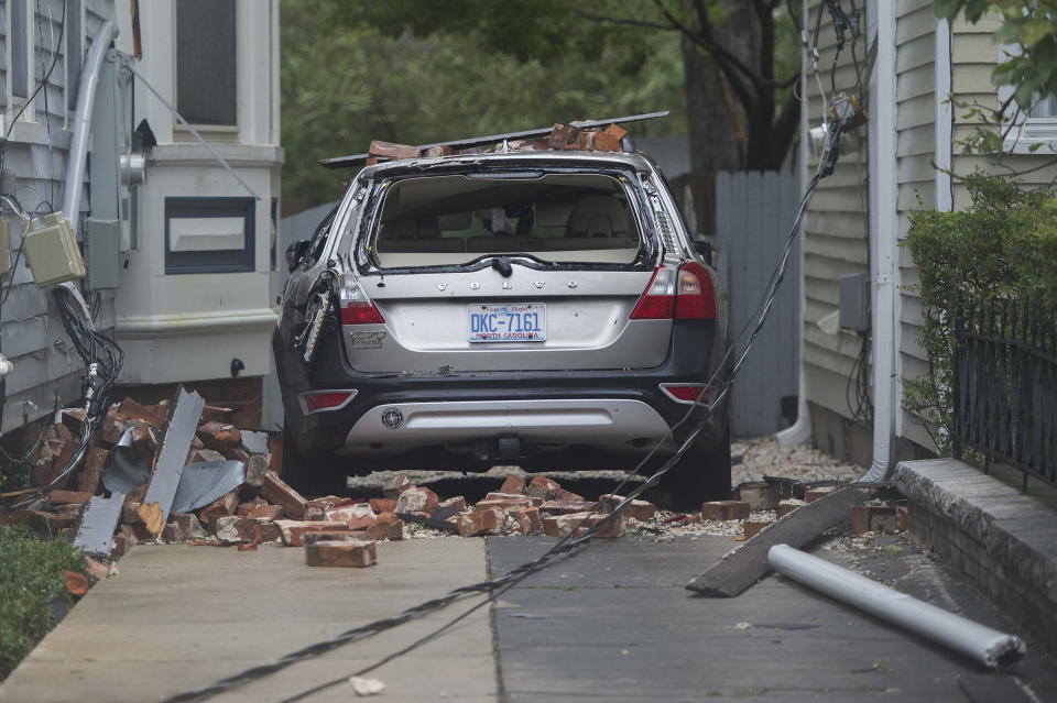 A car is destroyed from falling bricks as Hurricane Florence passes over Wilmington, North Carolina on Friday.