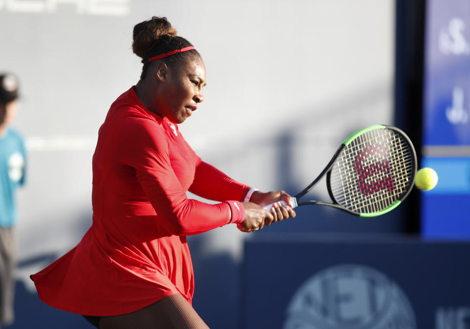 Serena Williams, of the United States, returns the ball to Johanna Konta, from Britain, during the first set of a match at the Mubadala Silicon Valley Classic tennis tournament in San Jose, Calif., Tuesday, July 31, 2018. Konta won 6-1, 6-0. (AP Photo/Tony Avelar)