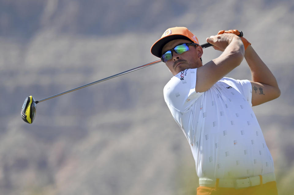 Rickie Fowler watches his tee shot on the third hole during final round of the CJ Cup golf tournament, Sunday, Oct. 17, 2021, in Las Vegas. (AP Photo/David Becker)