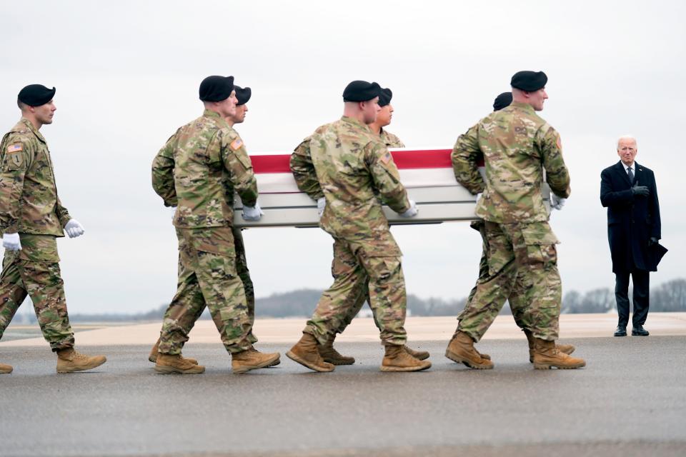 President Joe Biden, right, stands as an Army carry team moves the transfer case containing the remains of U.S. Army Sgt. William Jerome Rivers, 46, of Carrollton, Ga., at Dover Air Force Base, Del., Friday, Feb. 2, 2024. Rivers was killed in a drone attack in Jordan on Jan. 28. (AP Photo/Matt Rourke) ORG XMIT: DEMR509