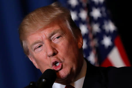 FILE PHOTO: U.S. President Donald Trump delivers a statement about missile strikes on a Syrian airfield, at his Mar-a-Lago estate in West Palm Beach, Florida, U.S., April 6, 2017. REUTERS/Carlos Barria/File Photo