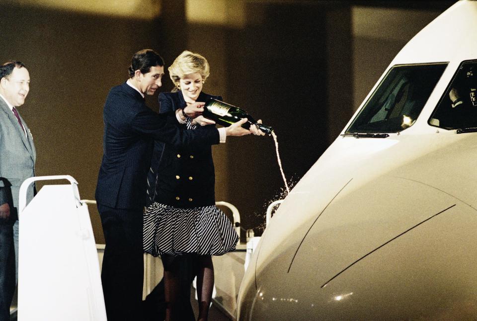 Prince Charles and Princess Diana of Wales pour champagne on the nose of the Airbus&closecurlyquote; latest model, the A-320 during the christening ceremony at Toulouse-Blagnac airport, southern France, Feb. 15, 1987.