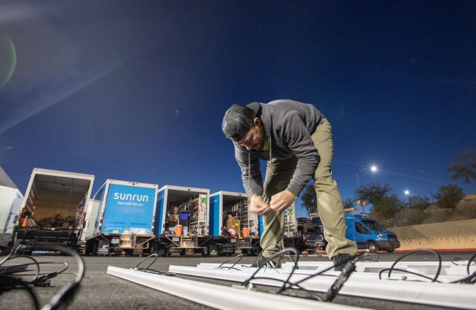 Sunrun employees prepare for the day ahead at the company's Nevada office in Henderson.