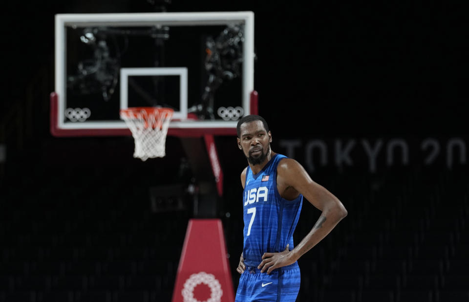 United States' Kevin Durant (7) reacts during men's basketball quarterfinal game against Spain at the 2020 Summer Olympics, Tuesday, Aug. 3, 2021, in Saitama, Japan. (AP Photo/Eric Gay)