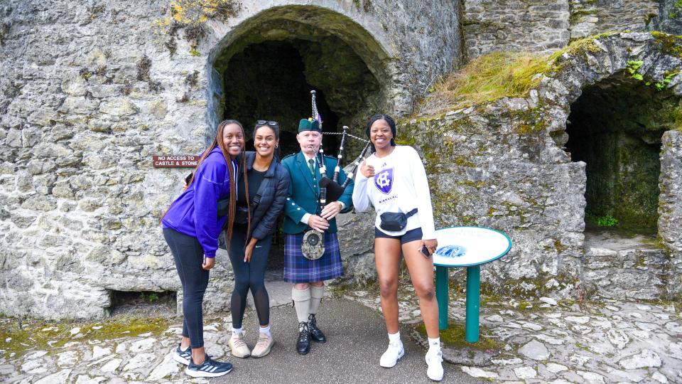 Players from the Holy Cross women's basketball team visit Blarney Castle during a recent trip to Dublin.